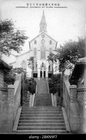 [ 1920s Japan - Oura Cathedral, Nagasaki ] —   Oura Cathedral, a Roman Catholic church in the Oura Foreign Settlement in Nagasaki. Oura Cathedral was the second Catholic church built in Japan after Japan opened its doors in 1853.  The church became world famous after Kakure Kirishitan (Hidden Christians who survived hundreds of years of persecution) approached French priest Bernard-Thadée Petitjean here on March 17, 1865.  20th century vintage postcard. Stock Photo