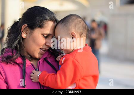 close up shot of mother with her little daughter facing each other Stock Photo