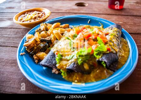 Kadmzima Plate a dish of blue corn enchiladas with ground beef at the Y'aak’a Café at the Acoma Pueblo, New Mexico. Stock Photo