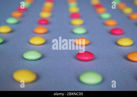 Multicolored dragees arranged in rows Stock Photo