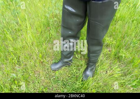 muddy rubber boots isolated on a white background . Stock Photo