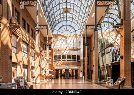 Eindhoven, The Netherlands, April 21st 2020. Interior of the famous ‘Heuvel Galerie’ building with glass ceiling in the center of Eindhoven during loc Stock Photo