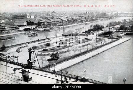 [ 1920s Japan - Nakanoshima Park, Osaka ] —   Opened in 1891 (Meiji 24), Nakanoshima Park was Osaka’s very first public park.  The bridge in front is is Naniwabashi Bridge.  20th century vintage postcard. Stock Photo