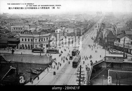 [ 1920s Japan - Osaka Street View ] —   Streetcars cross an intersection and Nagahoribashi Bridge in Osaka. The Nagohori canal was reclaimed in 1964 (Showa 39), creating Nagahori-dori.  20th century vintage postcard. Stock Photo