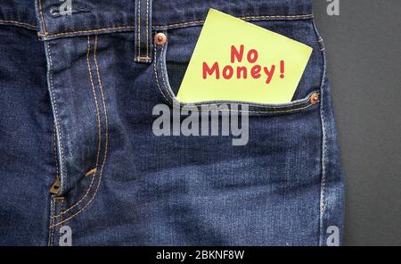 No money, words in red on a yellow paper stuck out from jeans pocket. Financial crisis concept. Stock Photo