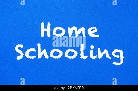 Homeschooling. Words or typed text on blue board. Education concept. Stock Photo