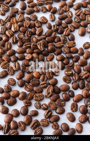 Roasted coffee beans on a piece of white marble Stock Photo