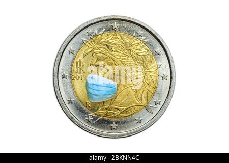 Close up of Italian two euro coin with surgical mask on poet Dante Alighieri from Florence in Italy. symbol of Italy during Covid-19 time. Italy and Stock Photo