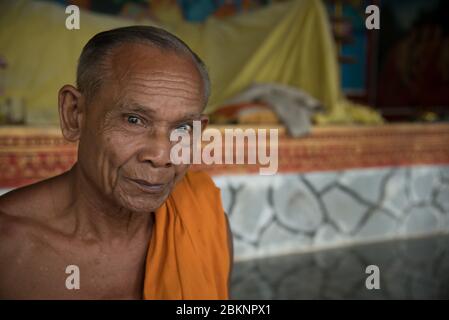 Close-up portrait of an older Indian Buddhist monk.  Phnom Chisor Monastery, Phnom Penh, Cambodia Stock Photo