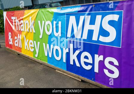 Large colourful rainbow banner, in gratitude to all NHS medical staff and keyworkers who are working during the UK Coronavirus pandemic crisis. Stock Photo