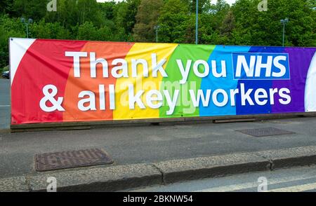 Large colourful rainbow banner, in gratitude to all NHS medical staff and keyworkers who are working during the UK Coronavirus pandemic crisis. Stock Photo