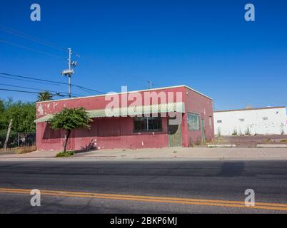 Old Coral Colored Building With Bars On Windows Stock Photo