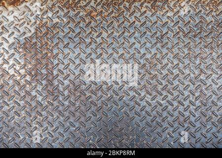 Old and rusted Metal diamond plate pattern texture, background Stock Photo