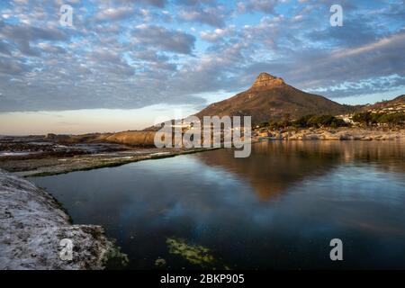 Landscape view of Camps Bay tidal pool and Lions Head Mountain, Cape Town, South Africa, beautiful destination. Stock Photo