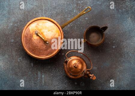 Old vintage copper empty tableware Stock Photo