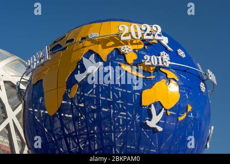 Beijing / China - February 20, 2016: Model of Earth with dates showing important Olympic events, promotion of the Beijing Winter Olympic Games 2022 in Stock Photo