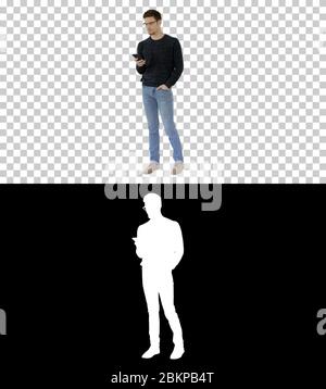 Man with glasses suffering with cough and using his phone, Alpha Channel Stock Photo