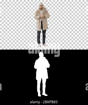 Young man using skin sanitizer to protection hisself from virus, Alpha Channel Stock Photo