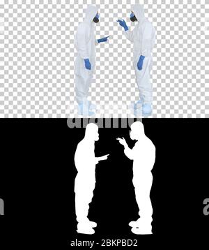 Doctors or scientists in hazamat suits meet and shake hands, Alpha Channel Stock Photo