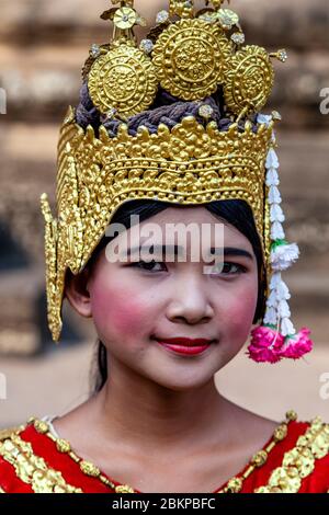 A Young Cambodian Woman in Traditional Costume, Angkor Wat Temple Complex, Siem Reap, Siem Reap Province, Cambodia. Stock Photo