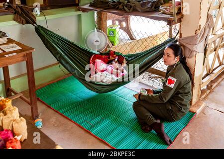 A Baby Sleeps In A Hammock At The Cambodian Landmine Museum, Siem Reap, Siem Reap Province, Cambodia. Stock Photo