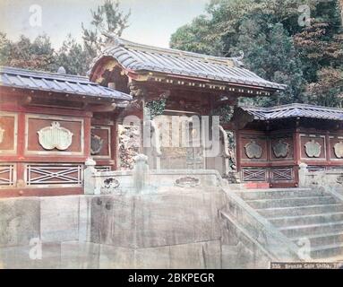 [ 1890s Japan - Mausoleum of Japanese Shogun ] —   Gate in front of the pagoda of the 9th Shogun Tokugawa Ieshige (Shunshinin) at Zojoji, Shiba, Tokyo, Japan.  Six Tokugawa Shoguns and wives and children of shoguns were entombed at the Tokugawa mausoleum at Zojoji. Much of the mausoleum was destroyed during the Great Kanto Earthquake of 1923 and what survived, was burnt down during the US fire bombings of Tokyo in 1945.  19th century vintage albumen photograph. Stock Photo