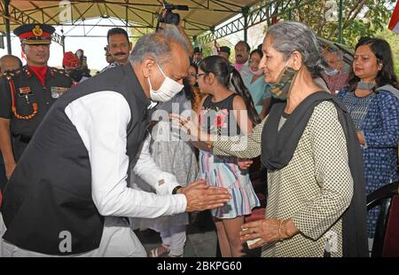Jaipur, India. 05th May, 2020. Rajasthan Chief Minister Ashok Gehlot pays respect to Mother of Colonel Ashutosh Sharma during the tribute paying ceremony at Military Station in Jaipur. Two senior army officers, a colonel and a major, were among five security personnel martyred in the encounter. (Photo by Sumit Saraswat/Pacific Press) Credit: Pacific Press Agency/Alamy Live News Stock Photo
