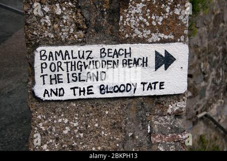 An amusing sign painted on a wall in the fishing village of St Ives, Cornwall Stock Photo