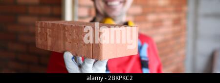 Joyful male wearing yellow helmet Stock Photo