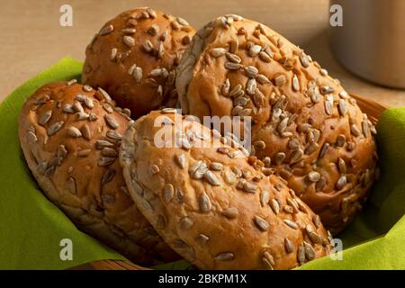 Fresh baked soft sunflower seed buns in a basket close up Stock Photo