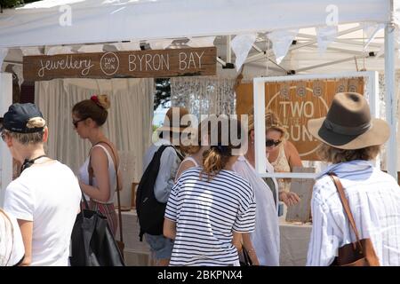 Byron Bay market and people browsing shopping at a jewellery stall in the market,New South Wales,Australia Stock Photo