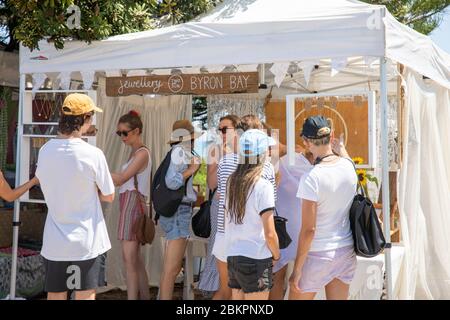 Byron Bay market and people browsing shopping at a jewellery stall in the market,New South Wales,Australia Stock Photo