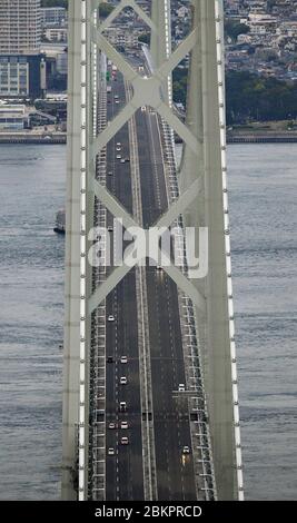 Osaka, Japan. 5th May, 2020. Photo taken from a Kyodo News helicopter on May 5, 2020, shows lighter traffic than usual at the Akashi Kaikyo Bridge in Kobe, western Japan, during the Golden Week holidays under a nationwide state of emergency declared over the coronavirus pandemic. (Kyodo)==Kyodo Photo via Credit: Newscom/Alamy Live News