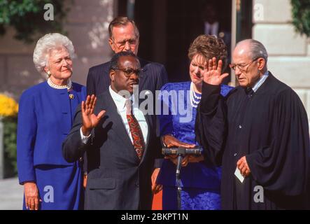 WASHINGTON, DC, USA, OCTOBER 18, 1991: Supreme Court Judge Clarence Thomas sworn in at White House by Justice Byron White, as President George H. W. Bush, First Lady Barbara Bush, and Virginia Lamp Thomas look on. Stock Photo