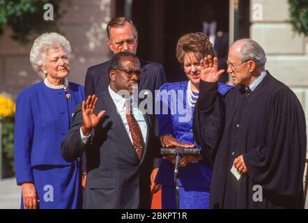 WASHINGTON, DC, USA, OCTOBER 18, 1991: Supreme Court Judge Clarence Thomas sworn in at White House by Justice Byron White, as President George H. W. Bush, First Lady Barbara Bush, and Virginia Lamp Thomas look on. Stock Photo