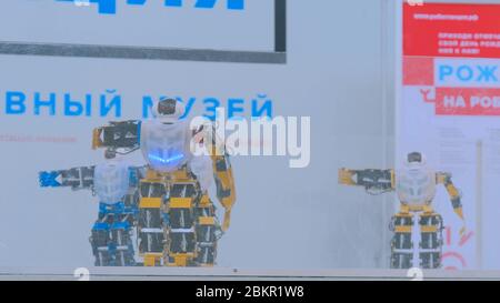 MOSCOW, RUSSIA - July 30, 2018: Robostation - future exhibition. Humanoid robots dancing at technology exhibition. Robotic concept Stock Photo