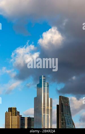 View of the City of London financial district skyline with stormy sky behind England UK. Stock Photo