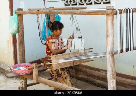 Laos, Luang Prabang city classified UNESCO world heritage, weaving woman Stock Photo