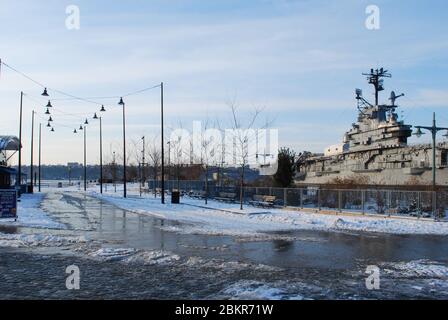 US Navy Aircraft Carrier Docked in Hudson River Greenway Hudson River, New York, United States Stock Photo