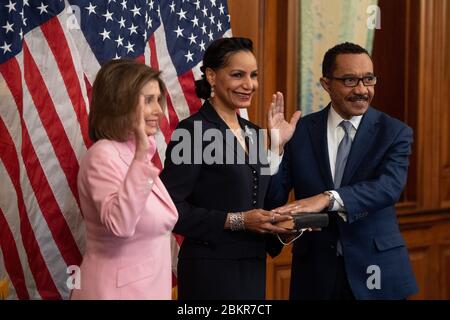 Washington, United Stats. 05th May, 2020. Speaker of the House Nancy Pelosi, D-Calif, swears-in Rep. Kweisi Mfume, D-MD, as his wife Tiffany McMillan, holds a bible, at the U.S. Capitol in Washington, DC on Tuesday, May 5, 2020. Mfume was voted in to replace the later Rep. Elija Cummings. Photo by Kevin Dietsch/UPI Credit: UPI/Alamy Live News Stock Photo