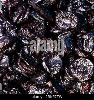 Prunes Macro. texture dry prunes closeup, food background. Stock Photo