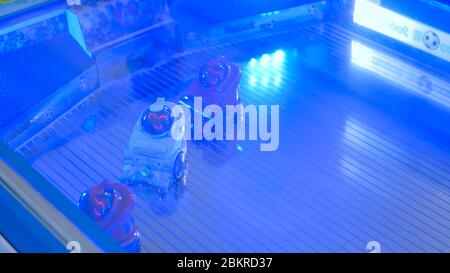 MOSCOW, RUSSIA - July 30, 2018: Robostation - future exhibition. Small cute robots playing soccer at technology exhibition. Future and robotic concept Stock Photo