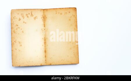 Opened old book isolated on white background. Copy space Stock Photo