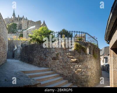 France, Manche, le Mont-Saint-Michel, alley and the abbey in the background Stock Photo