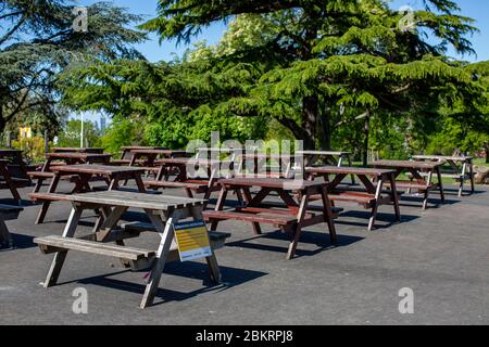 Brockwell Park, UK. 5th May, 2020. Picnic tables are closed and sealed off with red and white tape to help stop the spread of Coronavirus in Brockwell Park, South London, during the Coronavirus Lockdown. Brockwell Park is a 50.8 hectare park located south of Brixton, adjacent to Herne Hill and Tulse Hill in south London, England. (Credit: Sam Mellish/Alamy Live News) Stock Photo