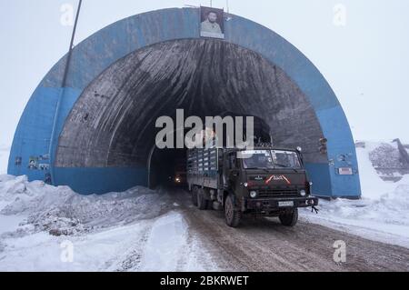 Salang Pass, Afghanistan - January 2015: Trucks pass through the Salang Tunnel, northern Afghanistan Stock Photo