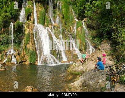 France, Ain Bregnier Cordon, ViaRhona, small family enjoying the freshness of the Glandieu waterfall Stock Photo