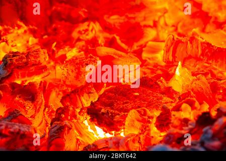 red hot coals in a blast furnace for metal melting. metal mining and processing industry. Red coals from a burnt fire made of wood Stock Photo