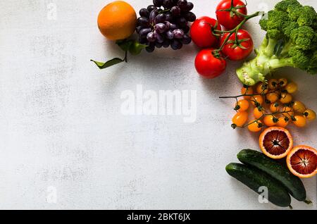 Fresh vegetables and fruits on a white kitchen table. Background for supermarkets, fresh food stores, delivery. Stock Photo