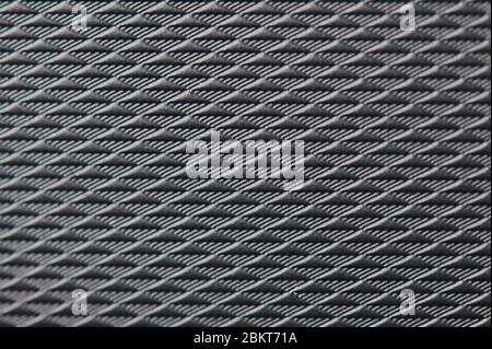 Triangle dark grey plastic surface pattern macro close up view Stock Photo